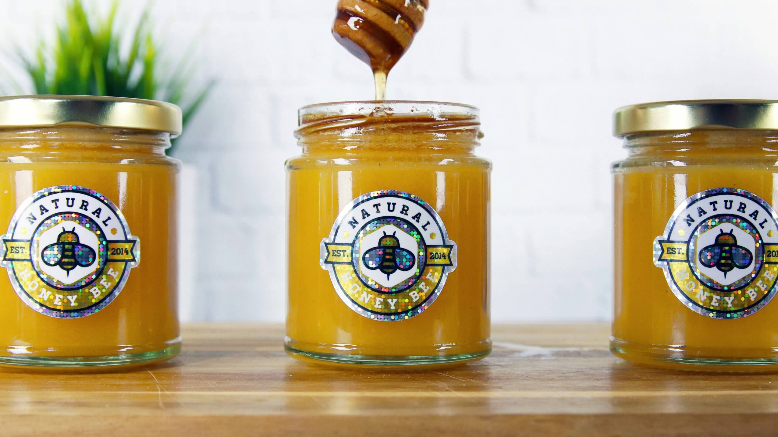 jar of honey with holographic embellishment on label jar of honey with holographic embellishment on label